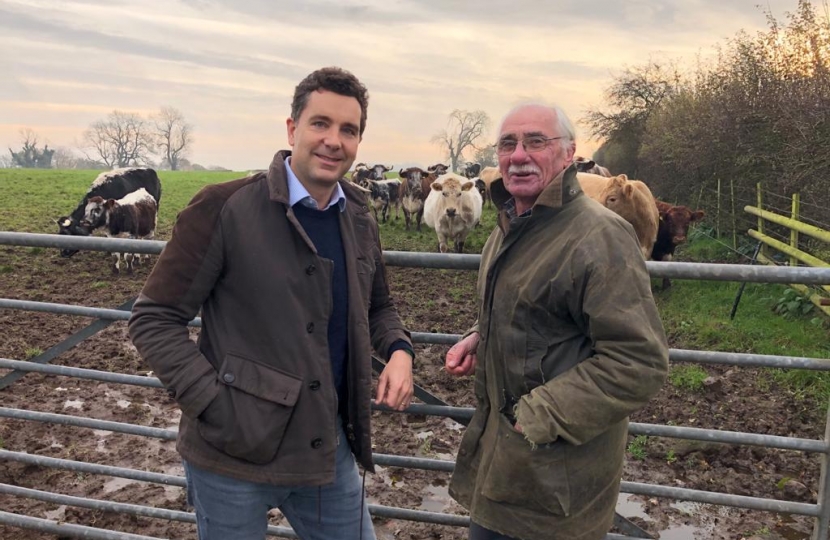Edward with Kelsall farmer Gavin Large and his herd