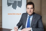 Edward Timpson signing book of commitment 